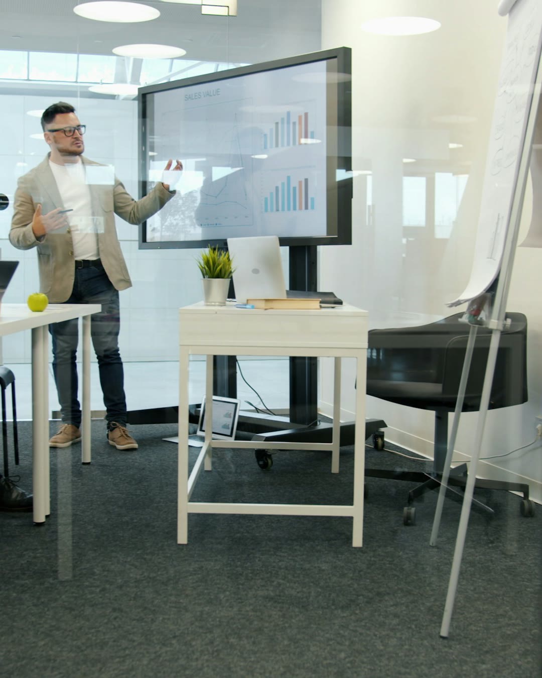 Corporate boardroom with a large wall display